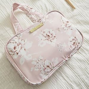 Yumi Kim ganging train case (travel)